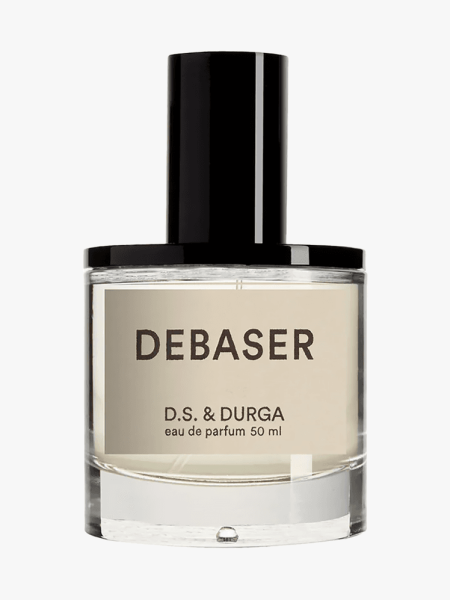 D.S. & Durga Debaser in branded glass bottle with black cap on light gray background